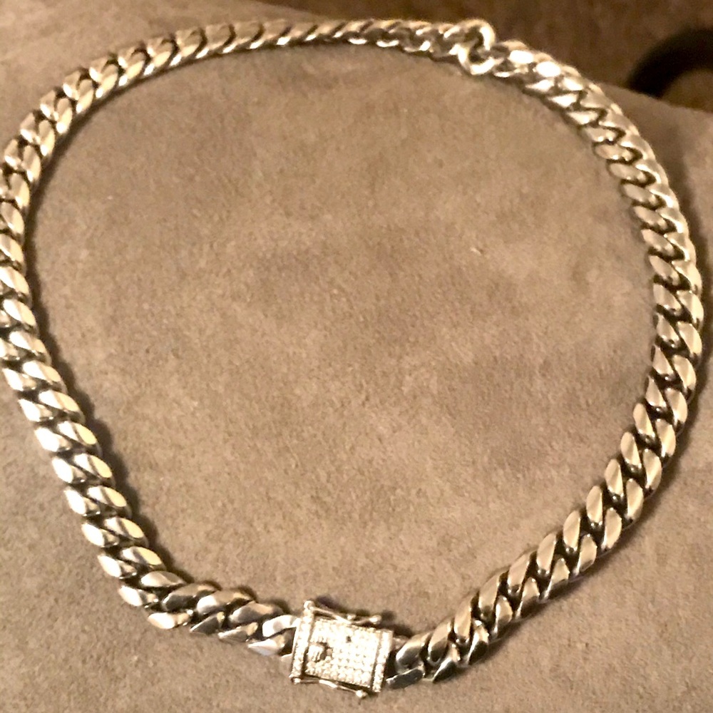 Solid Cuban chain 12mm thick by 22 inch long. Iced clasp